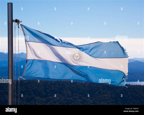 Blue and white flag of Argentina with May sun on white strip. Argentina ...