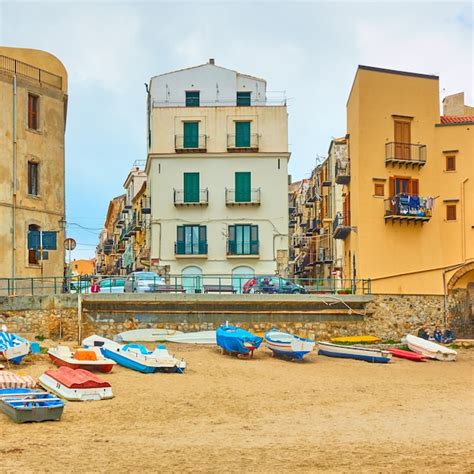 Premium Photo Boats On The Beach And Old Colorful Houses By The Sea