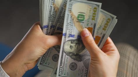 Woman Counting Us Dollar Bills Or Paying In Cash Stock Video