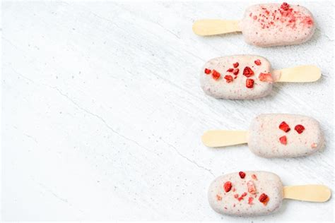 Premium Photo Chocolate Ice Cream On Sticks With Red Sprinkles