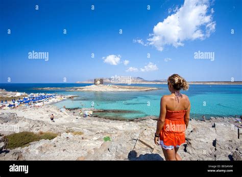 Stintino, La Pelosa beach, Sardinia, Italy. People bathing in the sea ...