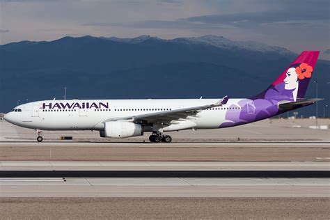 Download Hawaiian Airlines Plane Below Stormy Clouds Wallpaper ...