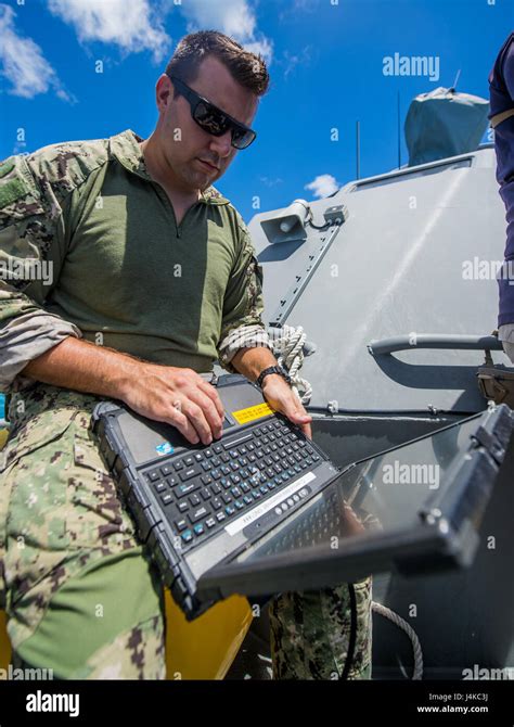 A Sailor Assigned To Explosive Ordnance Disposal Mobile Unit 5 EODMU5