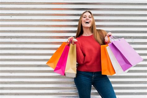 Free Photo Front View Girl Holding Shopping Bags