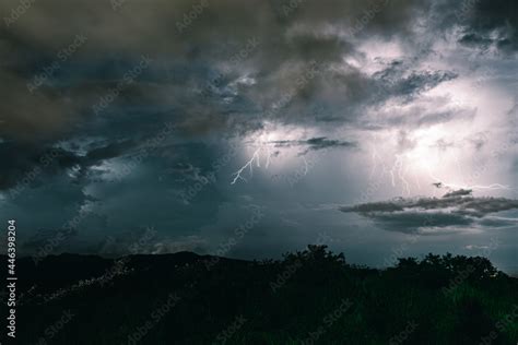 Storm sky with lightning among the dark clouds Stock Photo | Adobe Stock