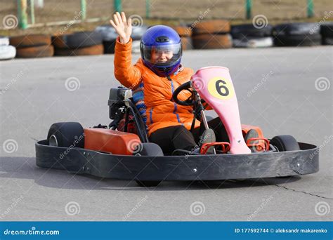 Girl is Driving Go-kart Car with Speed in a Playground Racing Track Stock Photo - Image of ...