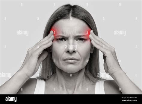 Woman Suffering From Headache Touching Her Temples Stock Photo Alamy