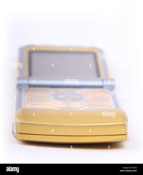 gold mobile phone   white background stock photo alamy