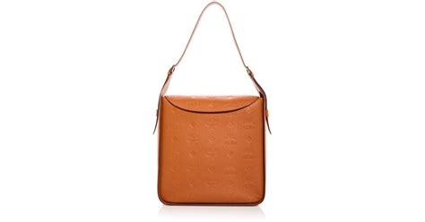 Mcm Aren Logo Embossed Leather Hobo In Brown Lyst