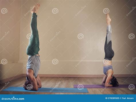 Hold And Breathe Full Length Shot Of Two Unrecognizable Yogis Holding