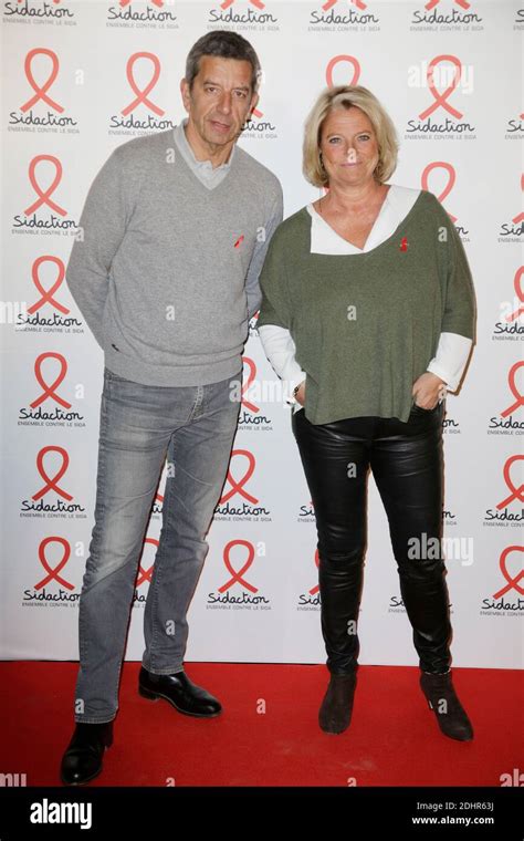 Marina Carrere Dencausse And Michel Cymes Posing At A Photocall For