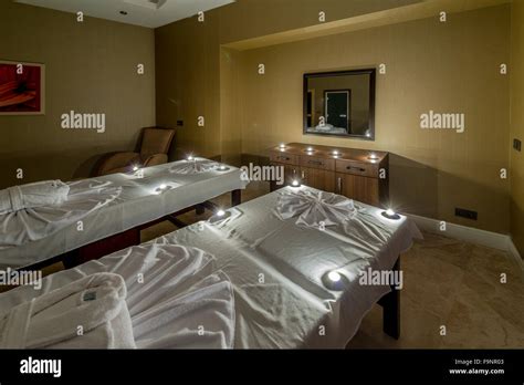 Spa room with burning candles Stock Photo - Alamy