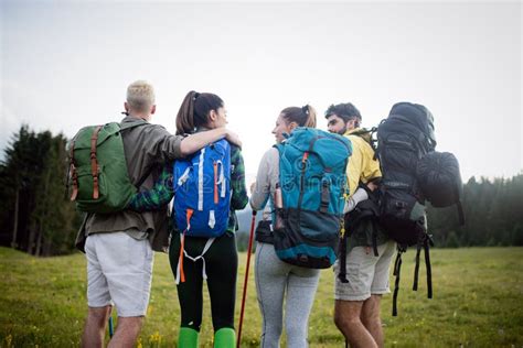 Friends Hiking Together Outdoors Exploring The Wilderness Stock Image