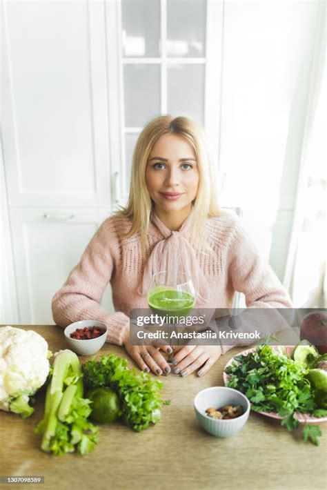 Young Beautiful Woman Drinking Green Juice For Detoxing Diet High Res