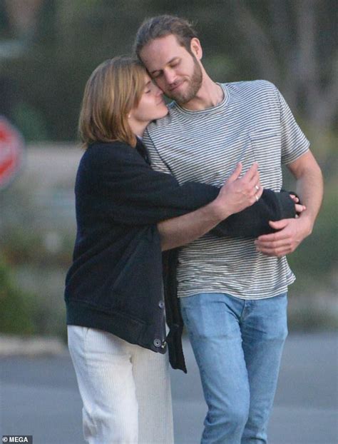 Emma Watson cuddles up to rumoured fiancé Leo Robinton during stroll ...