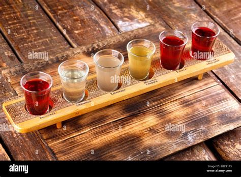 Colourful Set Of Alcoholic Cocktails In Shot Glasses Shooters On Wooden