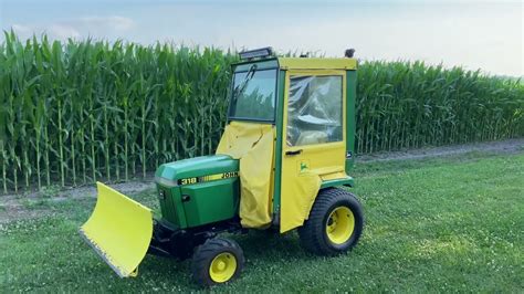 John Deere 318 With Blade And Snow Cab Youtube