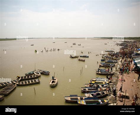 Boats and people on the ghats on the banks of Ganges river in Uttar ...