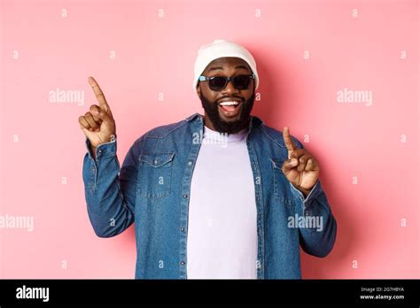 Happy Bearded African American Man Showing Announcement Pointing