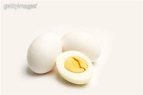 Halved Boiled Egg And Two Eggs