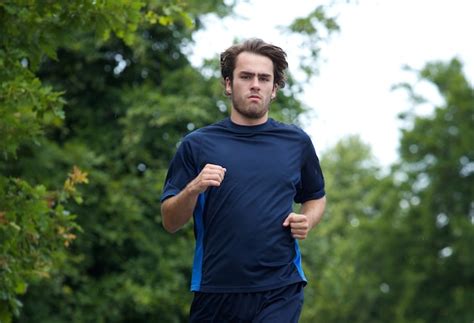 premium photo young man jogging outdoors