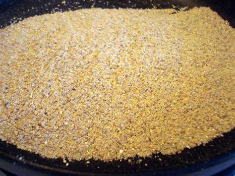 a black pan filled with food on top of a stove