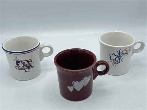 Lot - 3 Fiesta ware Holiday Mugs