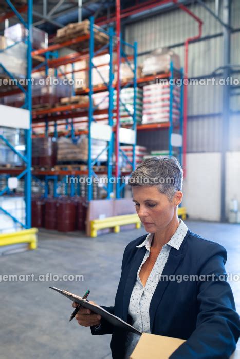 Close Up Of Beautiful Mature Caucasian Female Manager Checking Stocks