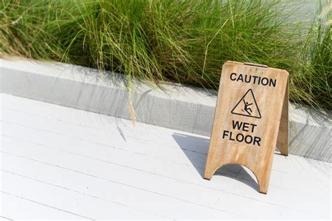 Wooden Wet Floor Caution Sign Stock Image - Image of beware, building ...