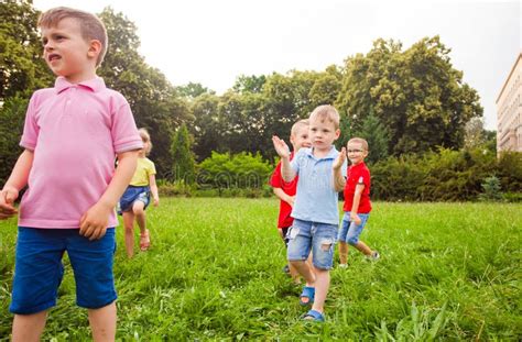 Children Playing Games in a Park in Summer Time. Stock Image - Image of ...