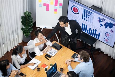 Wide Top View Diverse Analyst Team Analyzing Financial Data Meticulous