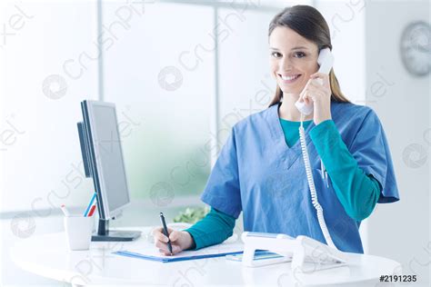 Female doctor at the reception desk - stock photo 2191235 | Crushpixel