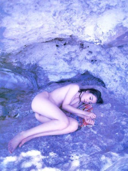 Skinny Asian Chick Relaxes Naked In A Pool Photos