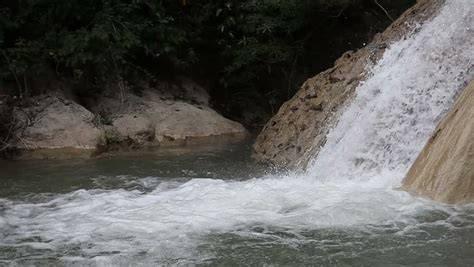 Video Closeup Of Waterfall Through Smooth Rock Formation. Smooth Stone River With Rapids And ...