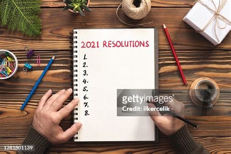 New Year 2021 Resolutions Concept On Note Pad High-Res Stock Photo ...