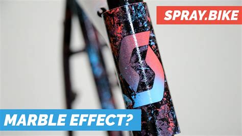 Spraying A Bicycle Frame With A Marble Effect Spray Bike Spray