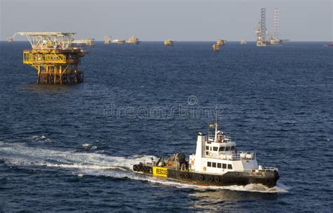 Oil Rigs And Supply Boat Stock Photo Image Of Oilfield 248606576