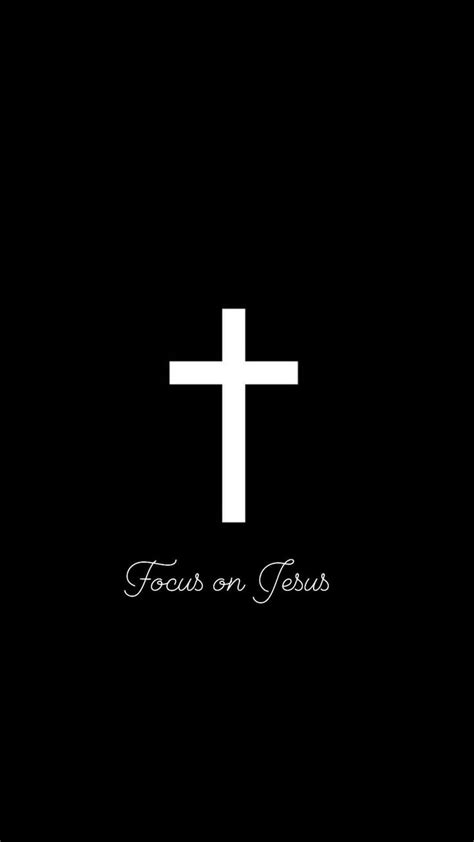 A White Cross On A Black Background With The Words Focus On Jesus