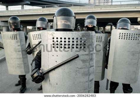 Group Riot Police Helmets Hitting Shields Stock Photo 2006282483