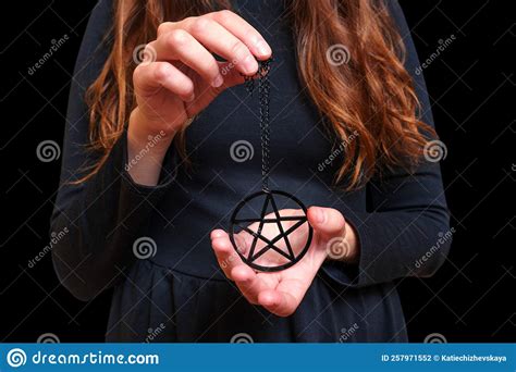 Woman in Black Dress with Pentagram Necklace on Black Stock Photo ...