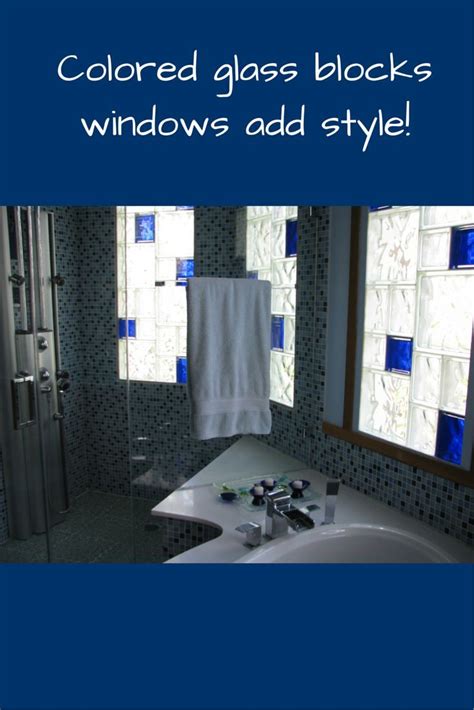 A Bathroom With Blue Glass Blocks On The Windows And Towels Hanging In