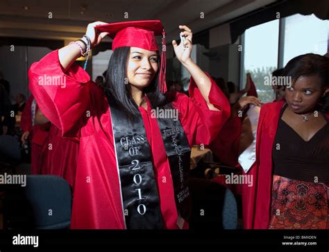 Hispanic female student prepares for her high school graduation ...