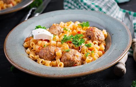 Premium Photo | Italian traditional ditalini pasta with meatballs in ...