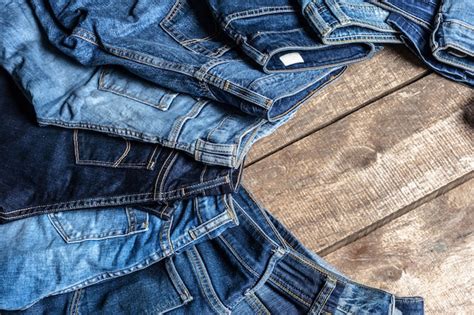 Premium Photo Jeans On Wooden Background