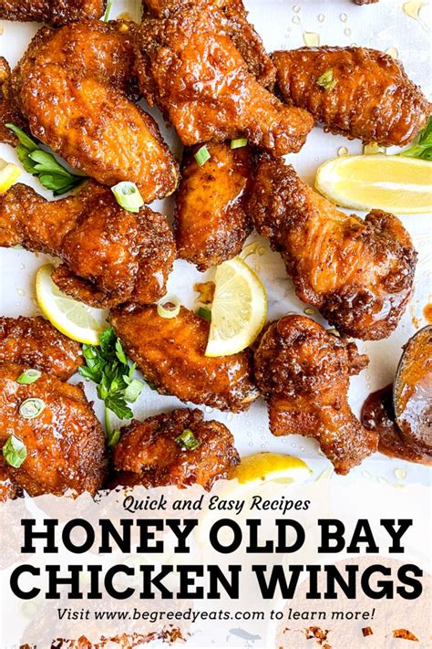 Honey Old Bay Chicken Wings With Lemon Wedges And Parsley On The Side