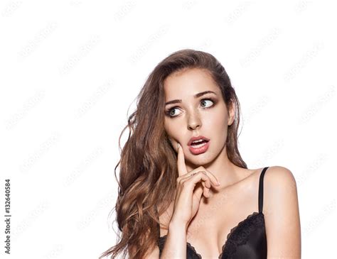 Portrait Of Surprised Beautiful Woman With Long Hair In Lingerie On A White Background Stock
