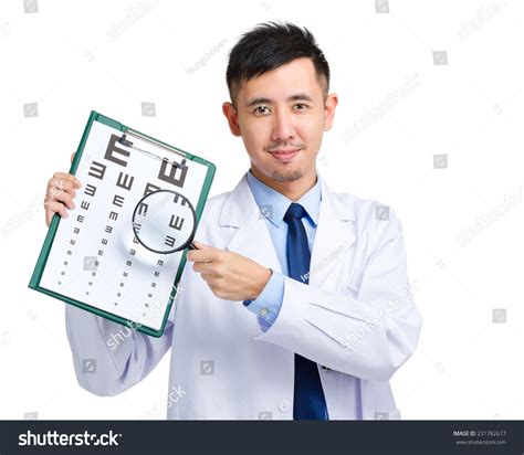 Optical Doctor With Eye Chart And Magnifying Glasses Stock Photo