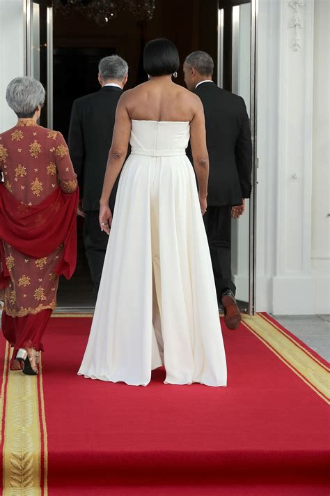 First Lady Michelle Obama Wore A Jackie KennedyInspired Ivory Dress At