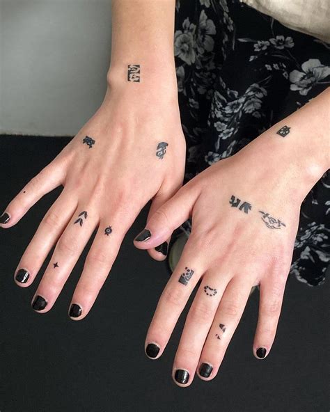 Small Tattoo On Finger