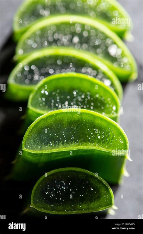 Aloe Vera Slices Stacked On Dark Board Gel Inside Aloe Leaf Health